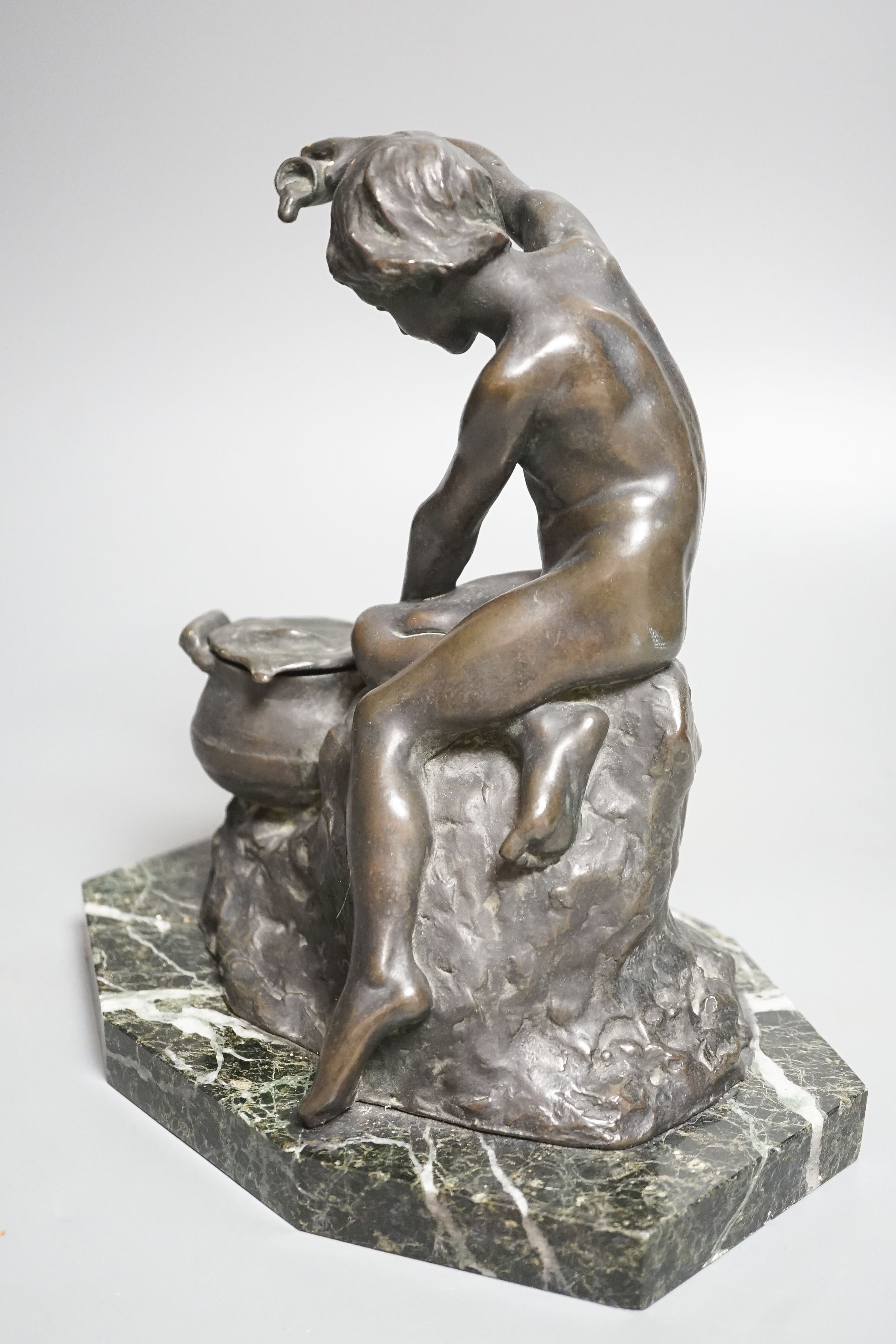 Lucy Gwendolen Williams (1870-1955). A bronze figure of a seated youth, green marble plinth, 24cm high